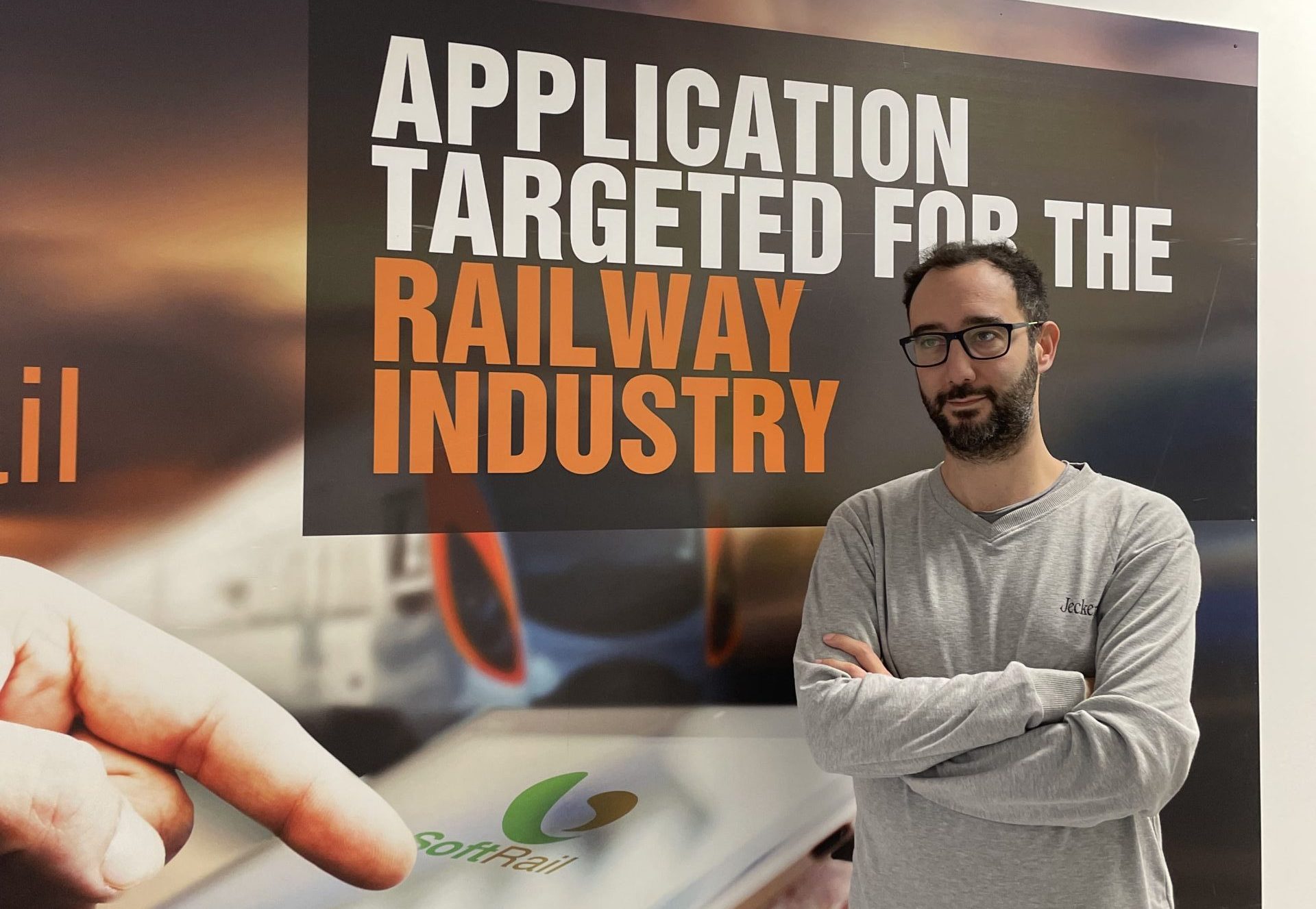 Our CTO in front of a Binary System's banner.