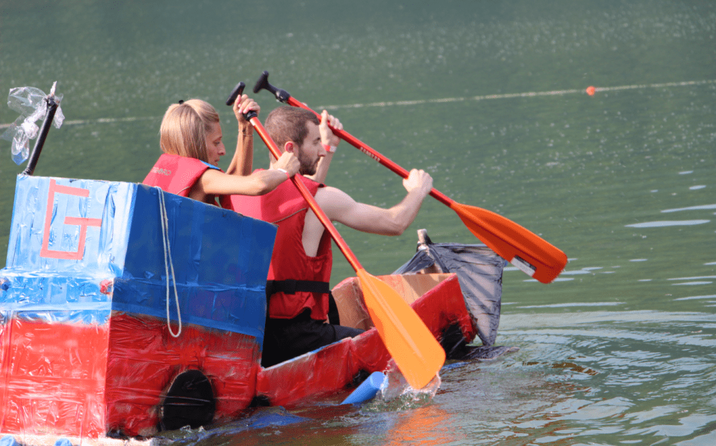 Two team members on the boat built during the Team Building.