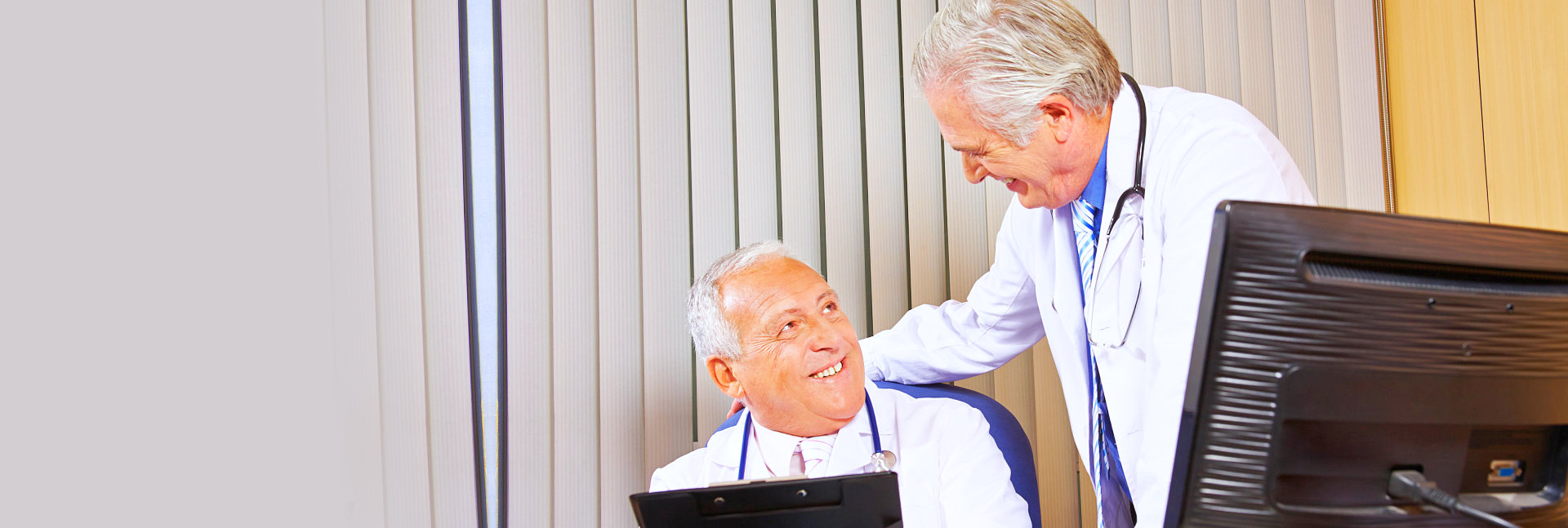 Two physicians in hospital office