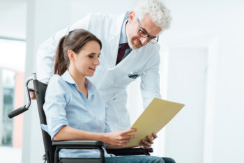 doctor and patient examining medical records